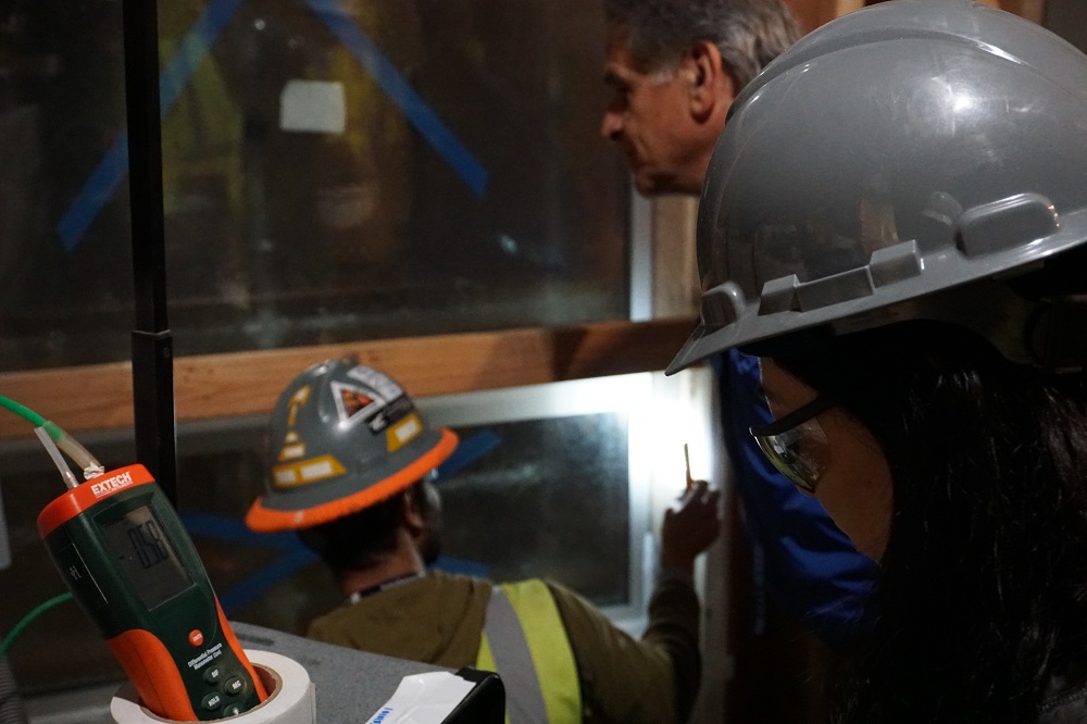 Examining Window Assembly of Mock Up for Building Waterproofing.