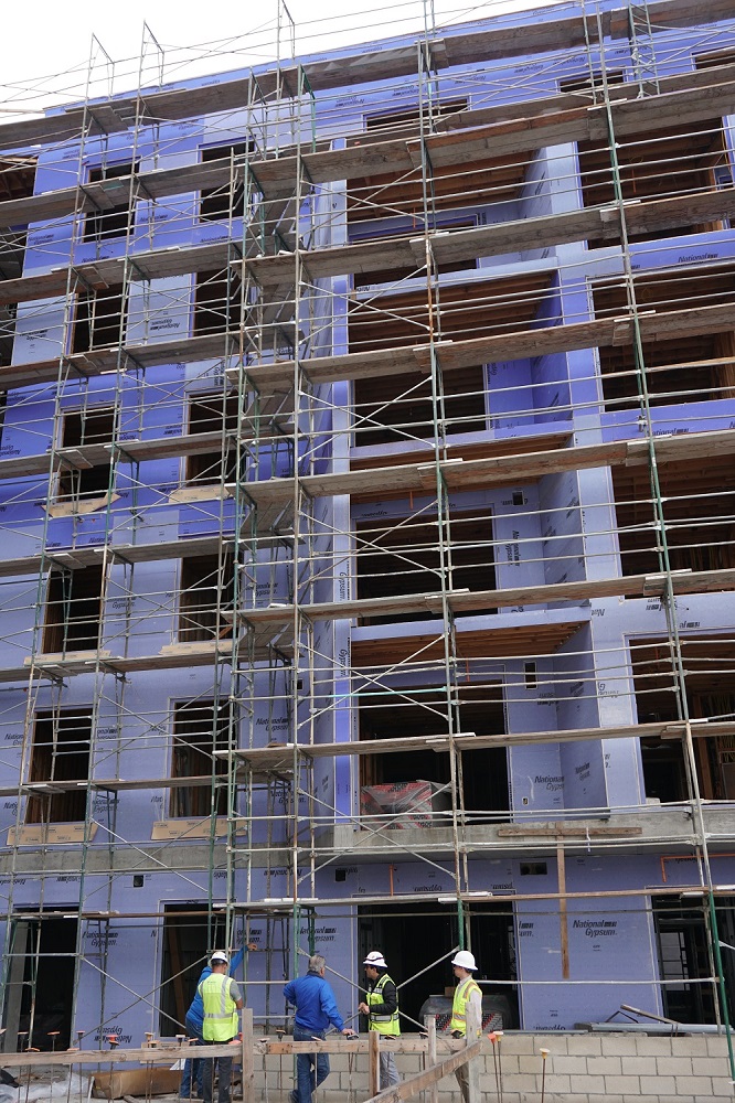 Job site meeting to discuss ways to address waterproofing Issues for new build.