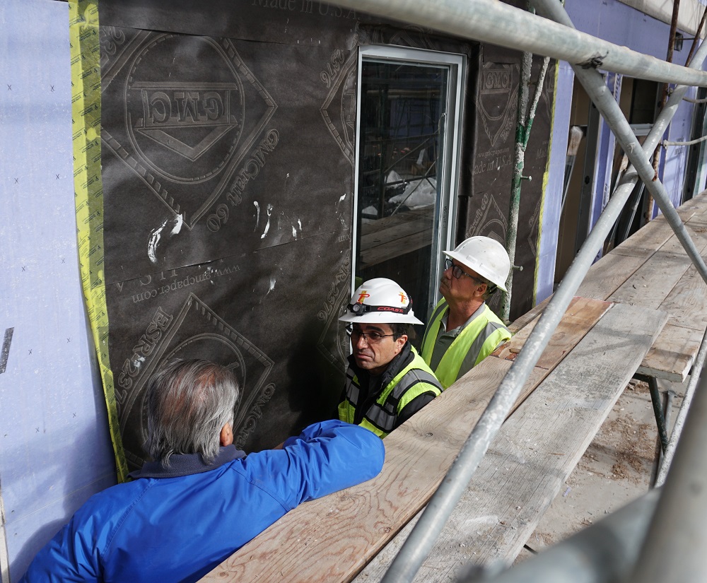 Project Superintendent discussing installation coordination matters with Terra-Petra waterproofing expert Barry Taheri.